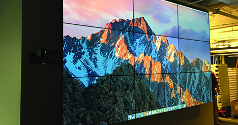 3x3 monitor grid installed in an office