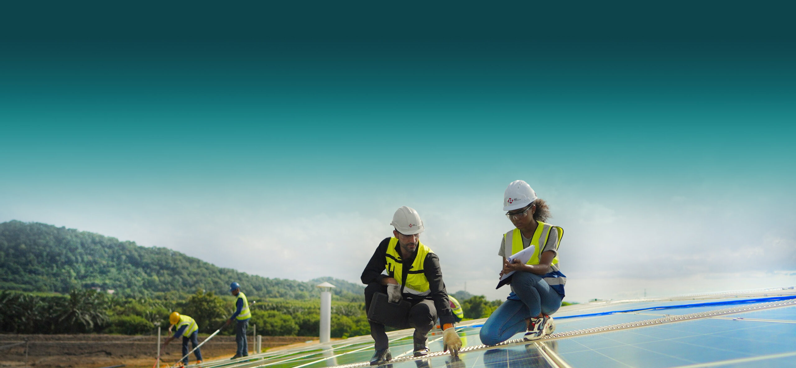 Professionals wearing EPP checking on solar panels 
