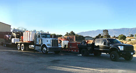 Two trucks at a construction site