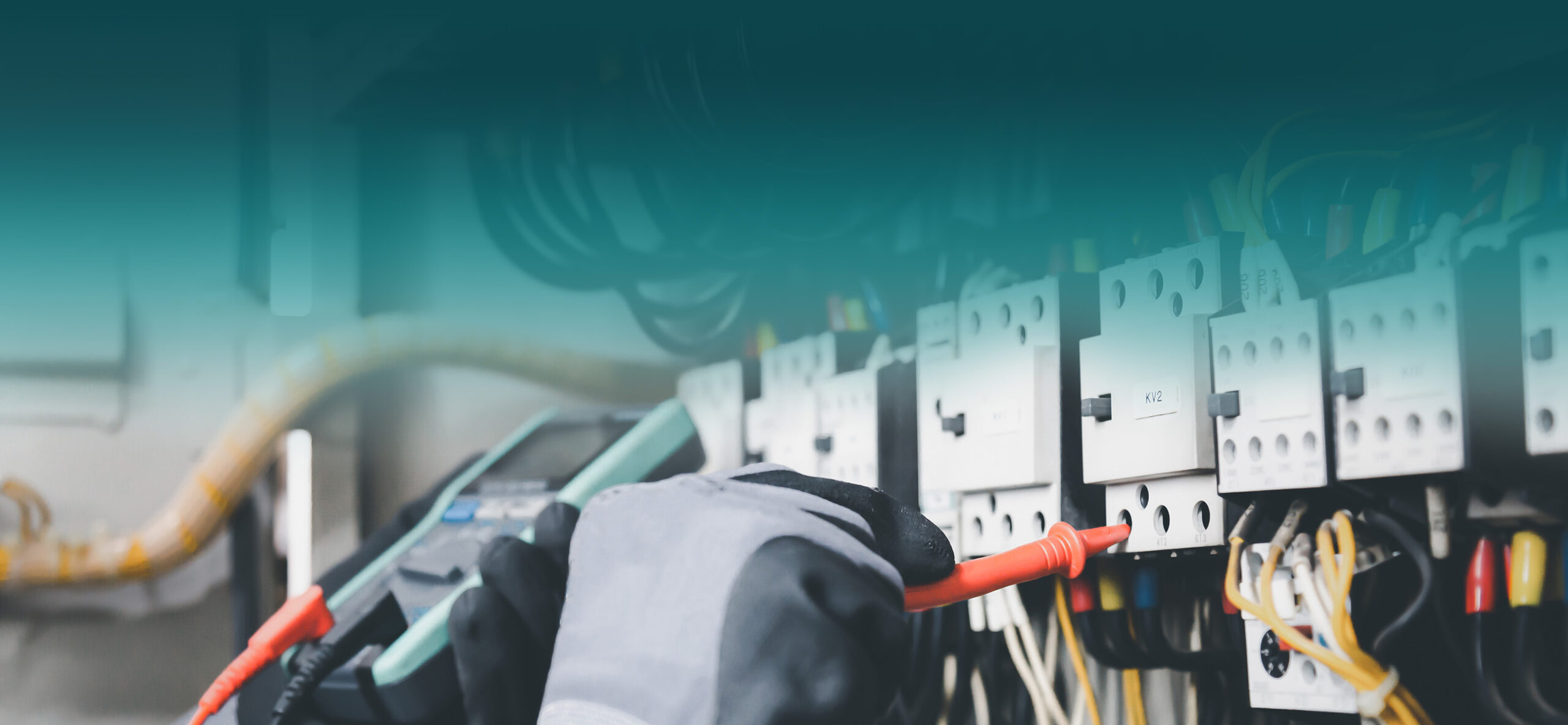 Hands checking electrical equipment