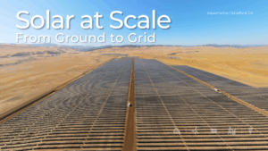 Aerial view of the Aquamarine solar project in Stratford, California, showing rows of utility-scale solar panels stretching across a desert landscape under clear skies. Text overlay reads: “Solar at Scale – From Ground to Grid.”