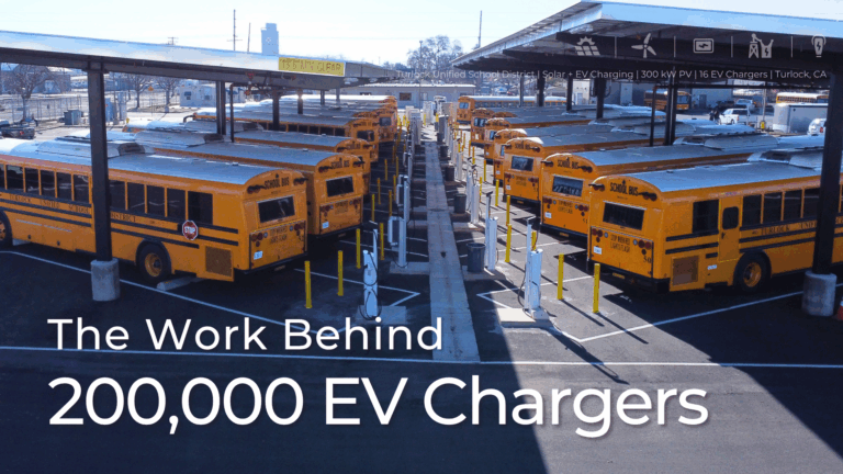 Electric school buses parked under solar canopies equipped with EV chargers at Turlock Unified School District in California. The image represents BEI Construction’s solar and EV charging project—300 kW PV and 16 EV chargers—highlighting California’s progress toward 200,000 public EV chargers.