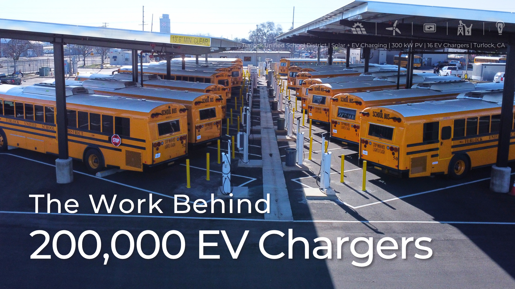 Electric school buses parked under solar canopies equipped with EV chargers at Turlock Unified School District in California. The image represents BEI Construction’s solar and EV charging project—300 kW PV and 16 EV chargers—highlighting California’s progress toward 200,000 public EV chargers.