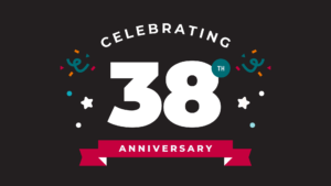 Graphic with the text “Celebrating 38th Anniversary” on a dark background, featuring large white number 38, a red ribbon banner with the word “Anniversary,” and small colorful confetti and celebration icons around the design.